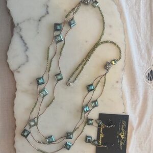 Strand of Iridescent glass beads on rose gold links with magnetic crystal ball